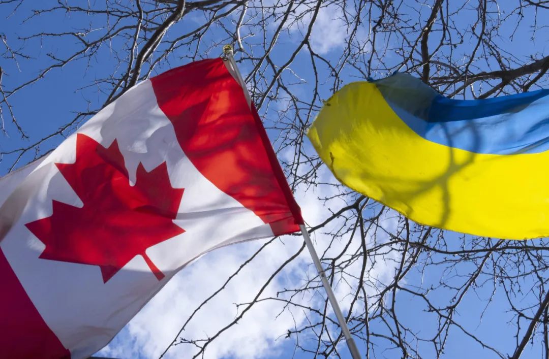 Canada and Ukraine flags flying together